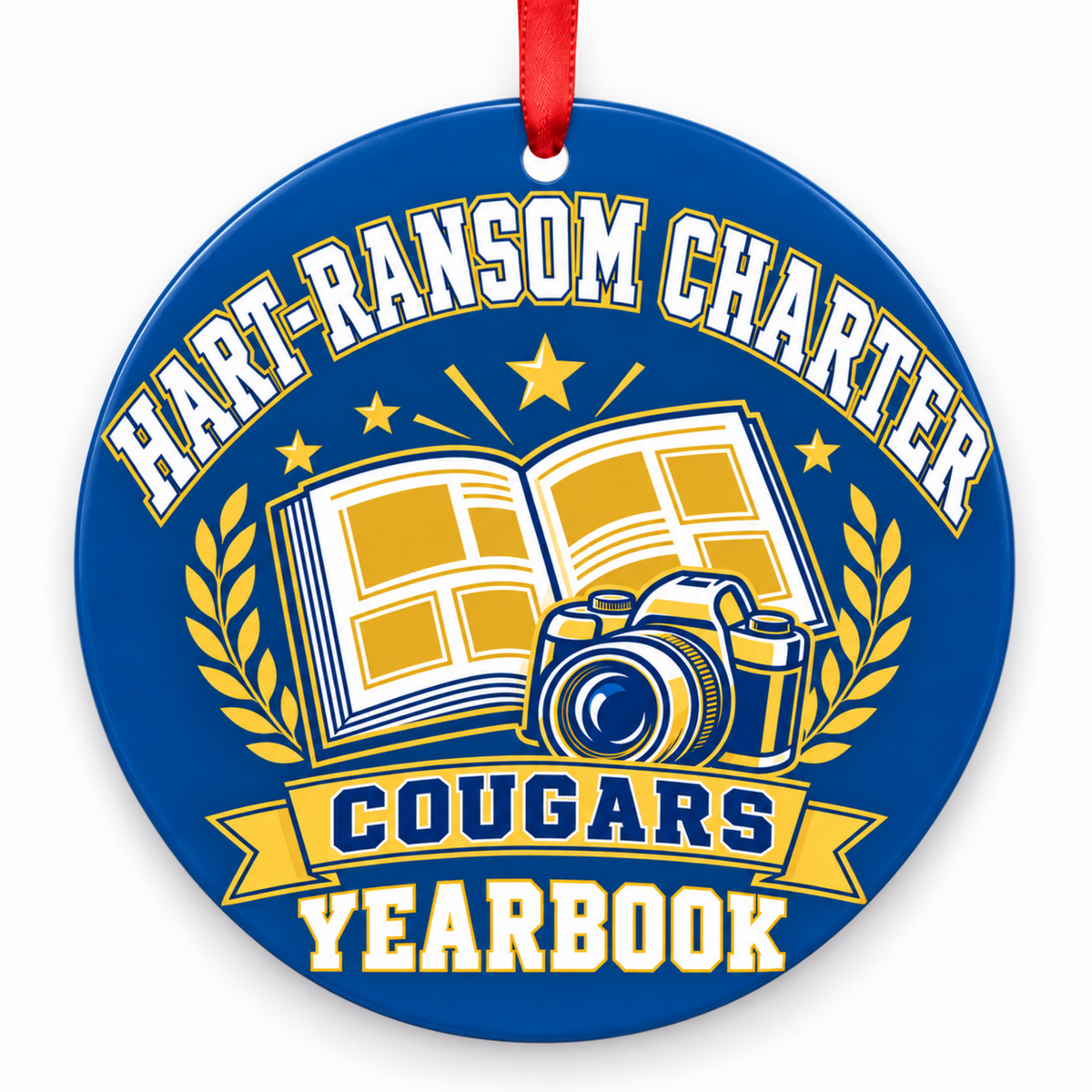 Hart-Ransom Charter Cougars Yearbook ornament in blue, white and gold, with a red ribbon