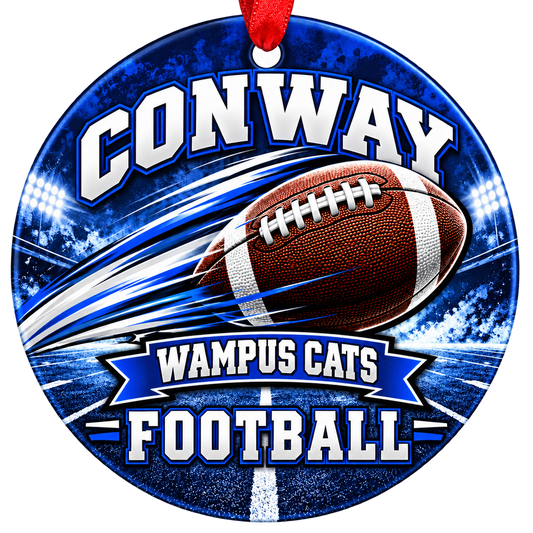 Conway Wampus Cats Football Christmas ornament with football with motion streaks and stadium lights in blue and white, red hanging ribbon.