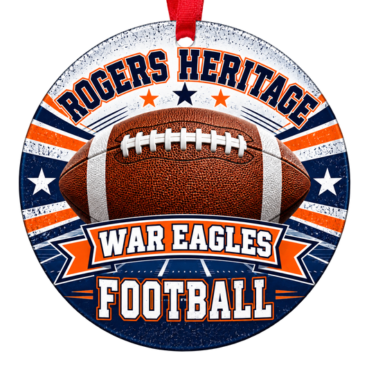 Rogers Heritage War Eagles Football Christmas ornament with football, stars and field artwork in navy blue and orange, red hanging ribbon.