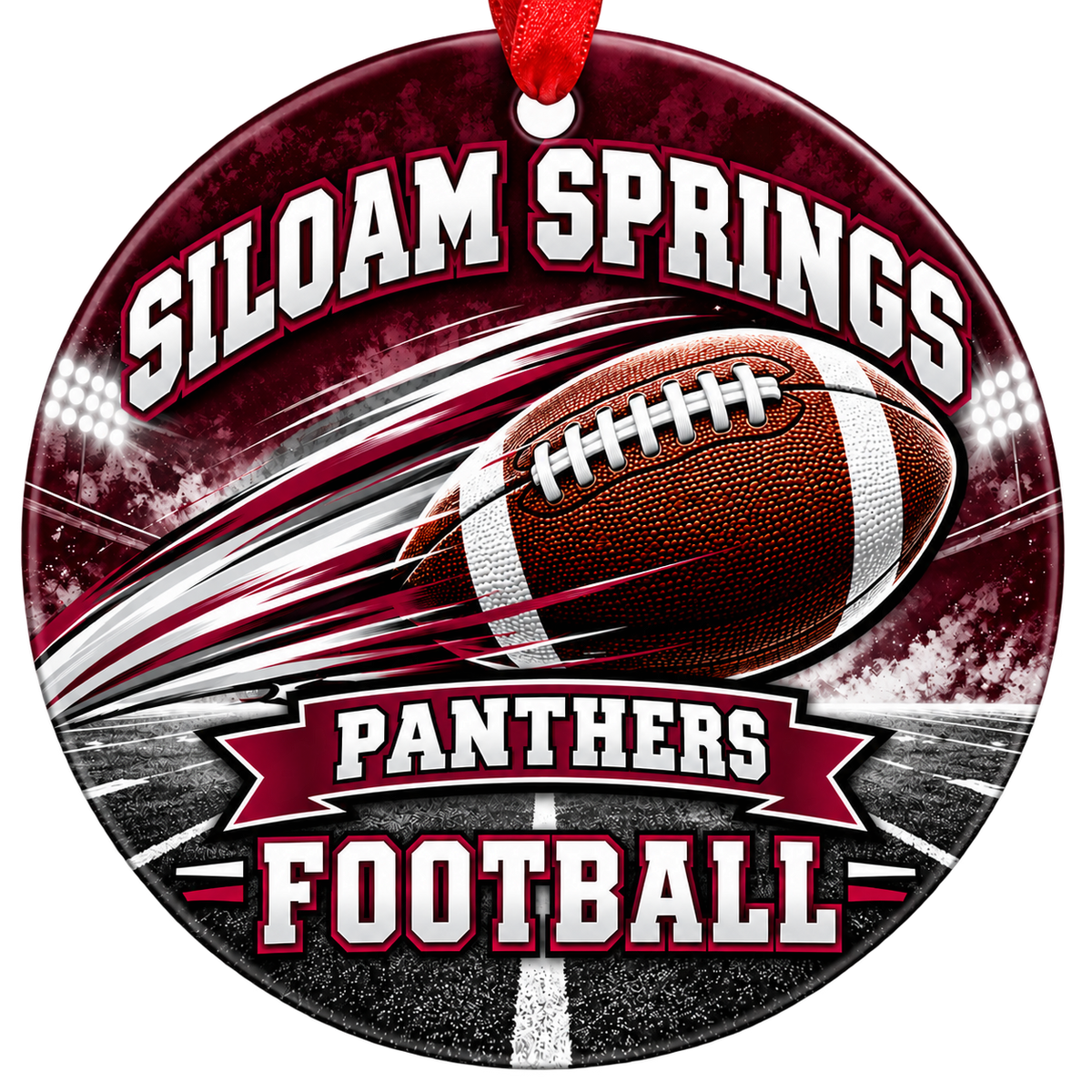 Siloam Springs Panthers Football Christmas ornament with football with motion streaks and stadium lights in maroon and gray, red hanging ribbon.