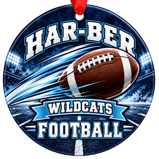 Har-Ber Wildcats Football Christmas ornament with football with motion streaks and stadium lights in navy blue and Carolina blue, red hanging ribbon.